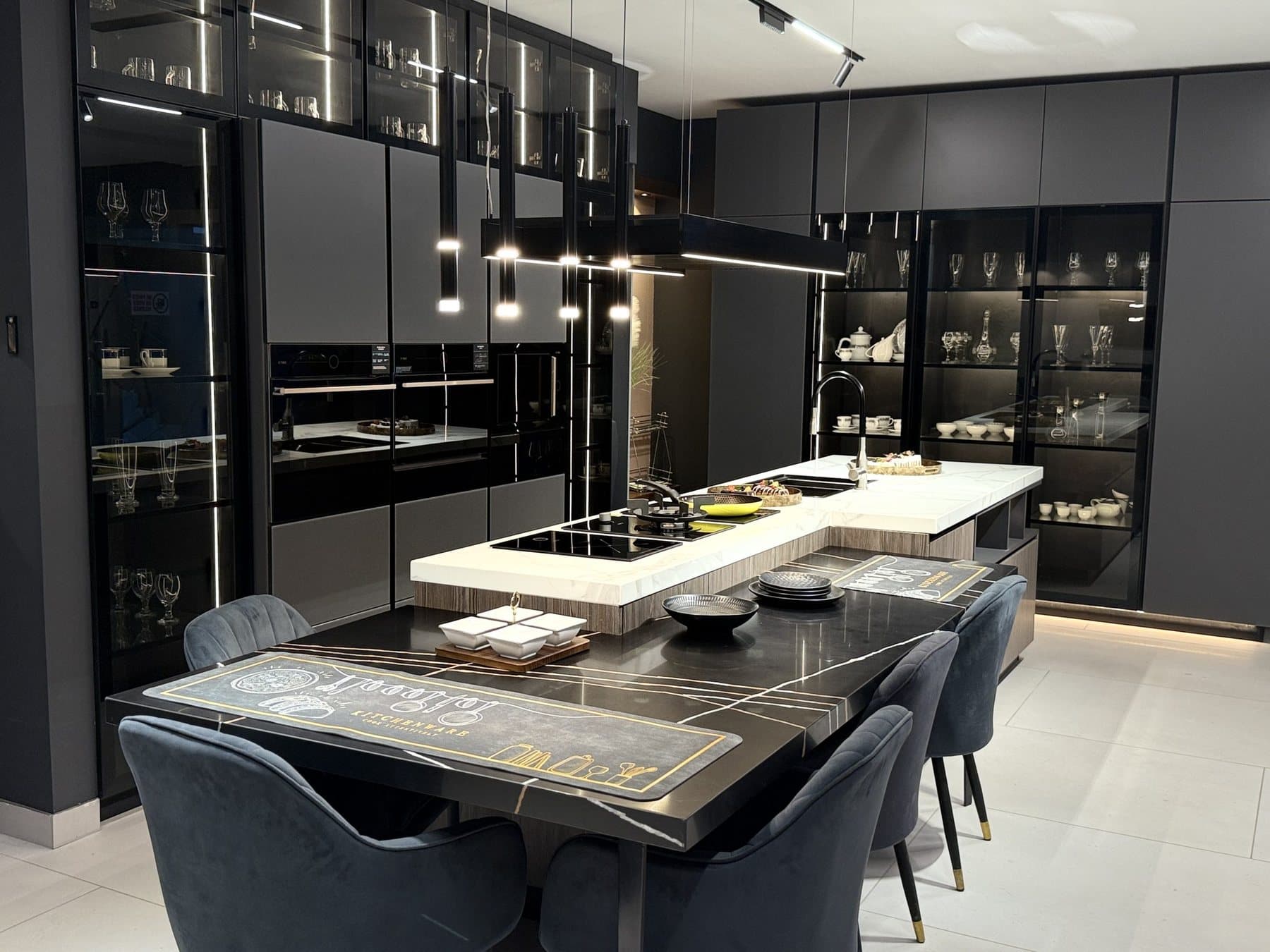 Warm walnut kitchen and study by Amaza Homes